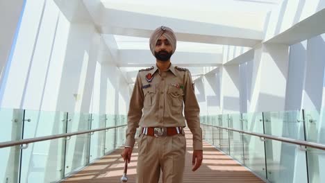Punjabi-police-officer-doing-his-rounds--mid-shot