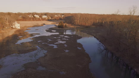 Drone-aerial-footage-Tidal-overflow-pool-and-marsh-in-Hingham,-MA