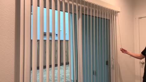 Installing-a-vertical-blind-on-a-sliding-glass-door-for-privacy