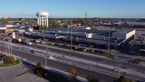 Toronto-water-tower-near-strip-mall-businesses-near-Eglinton-Corners-shopping-district