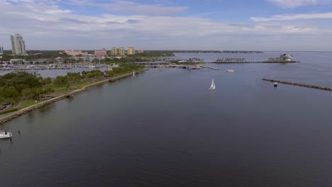 4K-Aerial-Drone-Video-of-Sailboats-and-Yachts-entering-Marina-on-Tampa-Bay-by-the-St-Pete-Pier-in-Downtown-St
