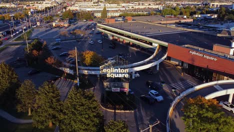 Eglinton-Square-sign-reveal-shopping-centre,-multi-level-parking-garage-and-area-with-retail-shops-and-businesses