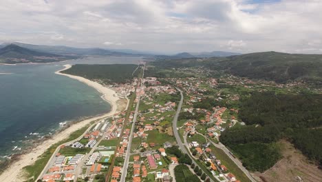 An-aerial-journey-down-a-beautiful-coastline-beach-in-Moledo-Beach,-Portugal,-Travel-Destination