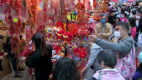 Chinese-buyers-shop-for-Chinese-New-Year-decorative-ornaments-goods-at-a-street-market-during-the-preparation-ahead-of-the-Chinese-New-Year-celebration-and-festivities