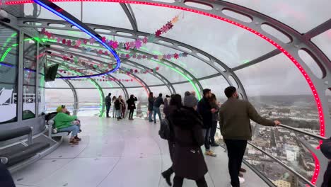 Tourists-and-people-walking-inside-i360-observation-tower-in-Brighton