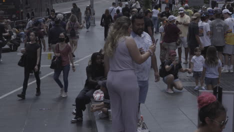 Static-shot-of-a-woman-showing-her-friend-the-picture-she-took-in-New-York