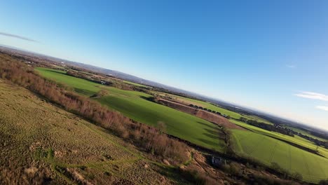 FPV-drone-flying-over-Billinge-hill-beacon-autumn-Lancashire-farmland-landscape