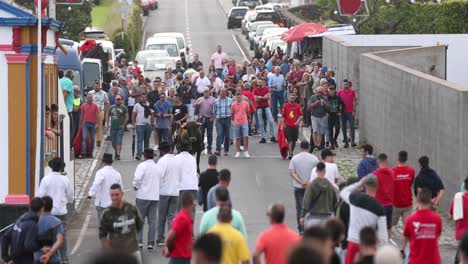 Crowd-Of-People-Around-Raging-Bull-In-Rope-On-The-Street