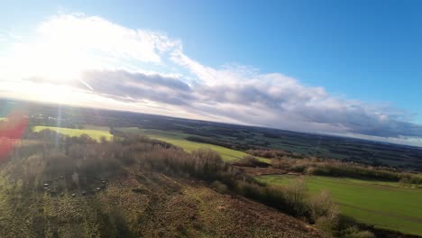 FPV-drone-flying-across-Billinge-hill-beacon-autumn-Lancashire-countryside-farmland