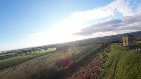 FPV-drone-flying-across-Billinge-hill-beacon-autumn-Lancashire-hiking-countryside