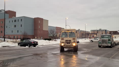 -National-guard-truck-entering-the-parking-lot-fall-of-snow