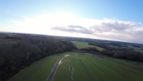 FPV-drone-flying-across-Billinge-hill-beacon-meadow-trees-autumn-Lancashire-farmland-landscape