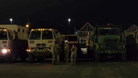 National-Guard-members-gather-in-in-car-park-in-the-aftermath-of-New-York's-Big-Freeze