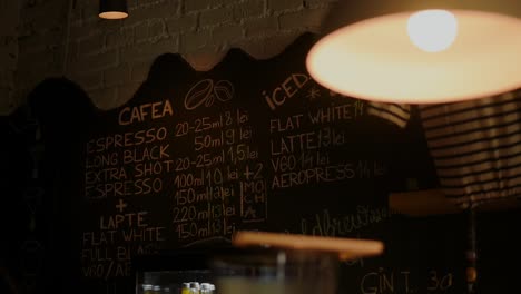 Close-up-shot-of-a-chalkboard-with-the-prices-of-the-products-in-the-coffee-shop