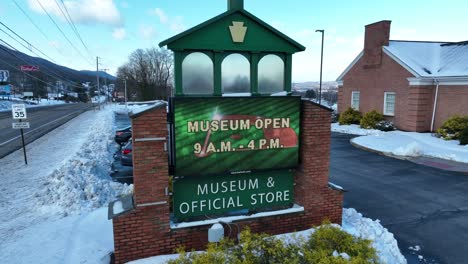 World-of-Little-League-Museum-and-Hall-of-Fame-sign-beside-snowy-road-in-Williamsport-PA