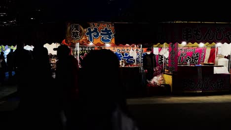 Street-Food-Vendor-Preparing-Food-at-Night-Market,-Tokyo,-Japan