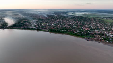 Establishing-Aerial-Fly-Drone-View-of-Riberalta,-Bolivia-with-jungle-amazon-forest-and-main-square