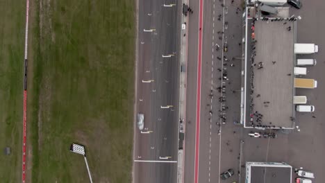 Angled-down-aerial-showing-race-cars-during-race-at-Mantorp-Park-in-Sweden