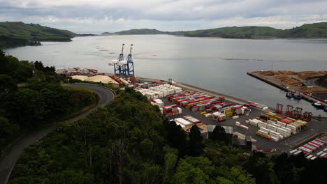 Colourful-ocean-containers-are-neatly-stacked-in-the-terminal-at-Port-Chalmers-in-Dunedin,-New-Zealand