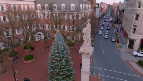 Aerial-orbit-around-statue-and-Christmas-tree-in-downtown-Lancaster-Pennsylvania