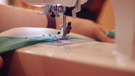 CLOSE-UP-Modern-Domestic-Sewing-Machine-Repairing-Clothing-SLOW-MOTION