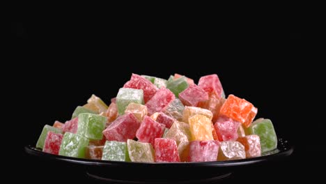 Colorful-traditional-Turkish-Delight-sweets-against-Black-background