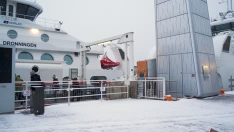 Passengers-Seen-Boarding-Dronningen-Ship-At-Aker-Brygge-In-January-2023-With-Snow