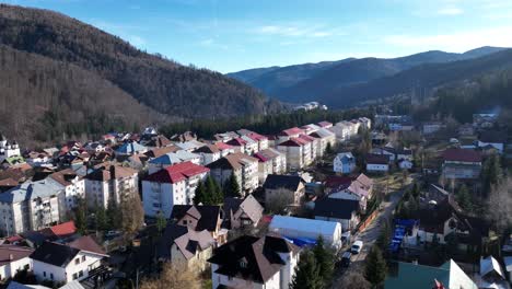 Aerial-view-of-similar-buildings-with-different-colored-roof-in-Sinaia-Town-during-summer-day