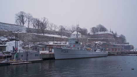 М314-Alta,-Sauda-Class-Minesweeper-Moored-Beside-Akershus-Castle-In-Oslo-During-Winter