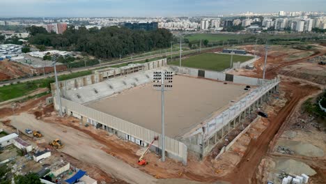 The-new-construction-of-the-sports-stadium-Northern-City-of-Rehovot--Israel--from-a-birds-eye-view--drone-4k-video