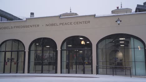 Snow-Falling-Outside-The-Nobel-Peace-Center-In-Oslo,-Norway