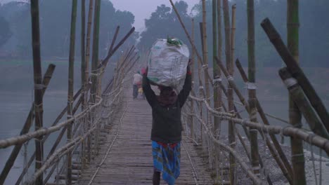 In-winter,-a-bamboo-bridge-is-constructed-on-the-river-due-to-the-water-shortage-and-the-people-of-the-upper-and-over-the-road-pass-through-it