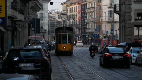 Old-iconic-tramway-ride-in-downtown-of-Milan-city,-front-view