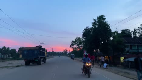POV-traveling-along-Sylhet-village-road-at-sunset