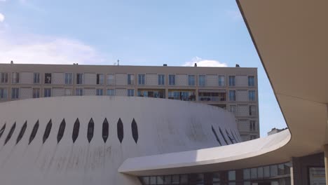 Tourists-walking-outside-of-Le-Volcan-in-Le-Havre,-France