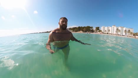 man-walking-into-the-sea