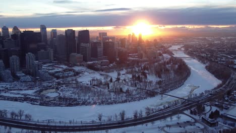A-drone's-aerial-view-of-Calgary's-downtown-during-a-winter-sunset
