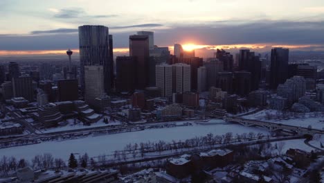 A-winter-sunset-captured-from-a-drone's-point-of-view-flying-over-Calgary-downtown