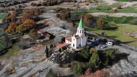 Aerial:-flying-over-a-chappel-in-the-catalan-countryside-in-Spain