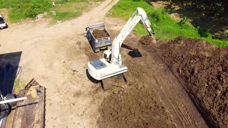 beautiful-aerial-view-with-drone-over-heavy-machinery-on-Ixhuatlan-del-café,-Veracruz,-Mexico