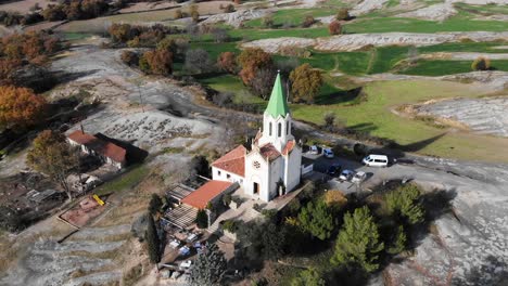 Aerial:-flying-over-a-chappel-in-the-catalan-countryside-in-Spain