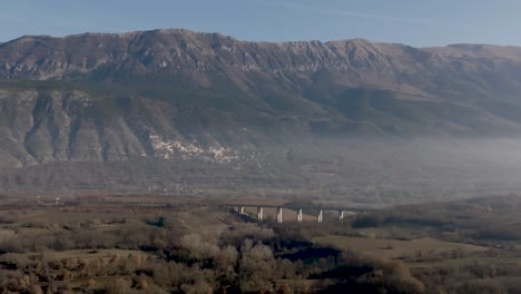 Bridge-in-mountain-range-of-Italy-with-drone-video-moving-forward