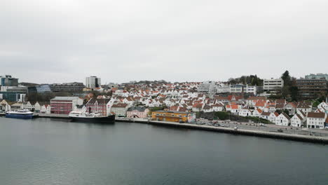 Aerial-view-along-waterfront-of-Vågen-harbor,-Stavanger,-Norway