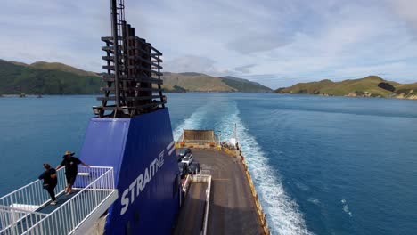 The-view-behind-the-Bluebridge-Straitsman-ferry-as-it-sails-through-the-Marlborough-Sounds-in-the-South-Island-of-New-Zealand