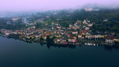 Aerial-Shot-in-Orta-San-Giulio-by-Lake-Orta-with-sunrise-sky-in-Italy