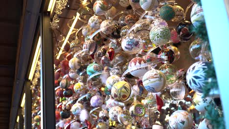 Beautiful-hand-painted-Christmas-bulbs-for-sale-at-the-Christmas-Village-market-in-Vienna,-Austria