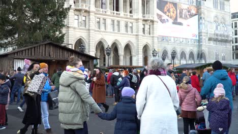 People-shopping-at-the-Christmas-Village-opposite-Vienna-town-hall