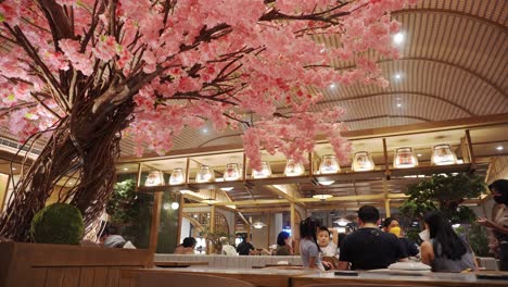 Still-shot-of-family-gathering-dining-in-a-japanese-themed-restaurant