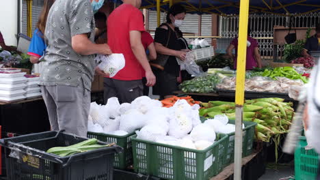 People-buying-vegetables-with-facemark-on-them