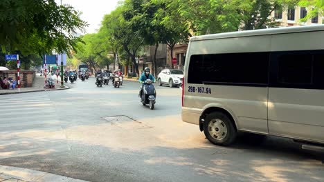 Busy-intersection-cars-and-scooters-day-time-Ho-Chi-Minh-City-Vietnam